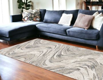 7' X 9' Gray And Tan Abstract Area Rug