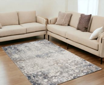 5' X 8' Navy And Beige Distressed Vines Area Rug