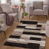 8' X 10' Black Brown And Beige Patchwork Area Rug